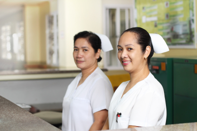 two nurses are smiling